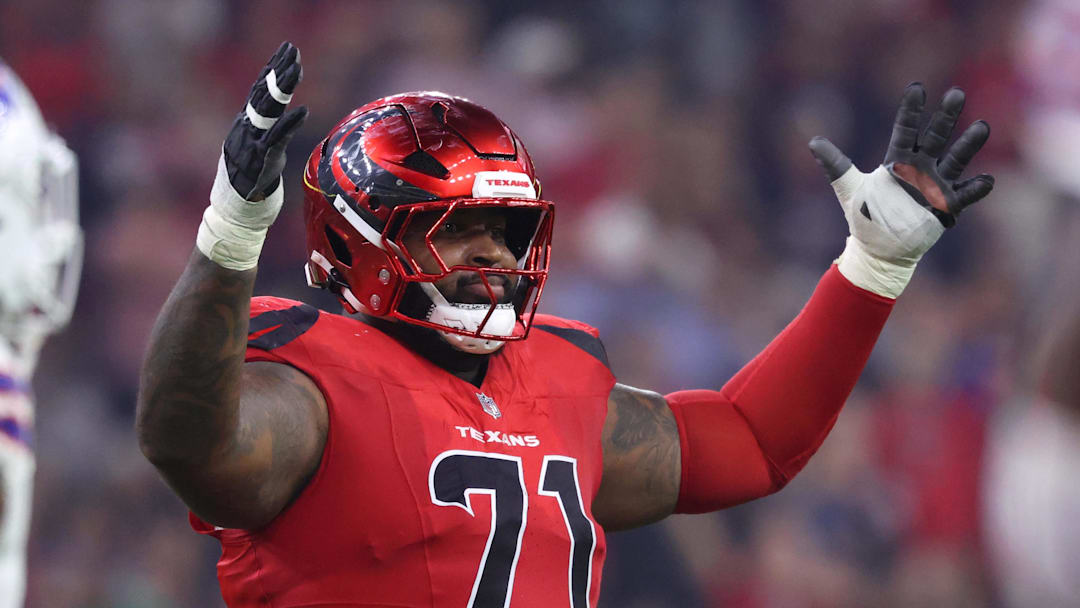 Nov 20, 2025; Houston, Texas, USA; Houston Texans offensive tackle Tytus Howard (71) reacts after a touchdown against the Buffalo Bills in the second quarter at NRG Stadium. Mandatory Credit: Troy Taormina-Imagn Images