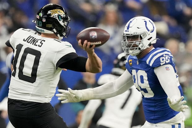 Indianapolis Colts defensive tackle DeForest Buckner (99) puts pressure on Jacksonville Jaguars quarterback Mac Jones(10).