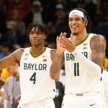 Mar 22, 2024; Memphis, TN, USA; Baylor Bears forward Jalen Bridges (11) and guard Ja'Kobe Walter (4) react during the second half against the Colgate Raiders in the NCAA Tournament First Round at FedExForum. Mandatory Credit: Petre Thomas-USA TODAY Sports