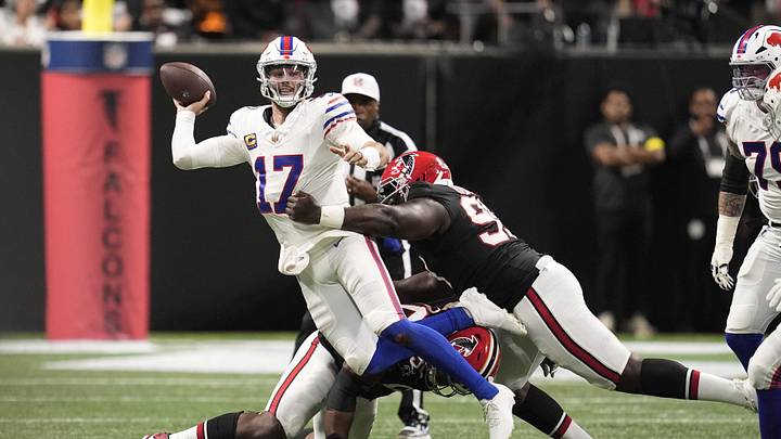 Oct 13, 2025; Atlanta, Georgia, USA; Atlanta Falcons defensive tackle David Onyemata (90) and defensive tackleSam Roberts (99) applie the pressure on Buffalo Bills quarterback Josh Allen (17) who is looking to show downfield during the second half of a game at Mercedes-Benz Stadium. Mandatory Credit: Dale Zanine-Imagn Images