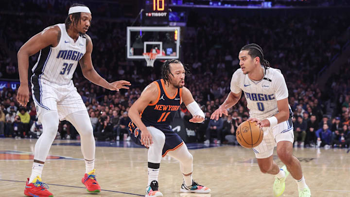 Jan 6, 2025; New York, New York, USA;  Orlando Magic guard Anthony Black (0) looks to drive past New York Knicks guard Jalen Brunson (11) in the fourth quarter at Madison Square Garden. Mandatory Credit: Wendell Cruz-Imagn Images