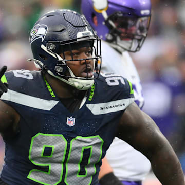 Dec 22, 2024; Seattle, Washington, USA; Seattle Seahawks defensive tackle Jarran Reed (90) celebrates after sacking Minnesota Vikings quarterback Sam Darnold (14) (not pictured) during the first half at Lumen Field.