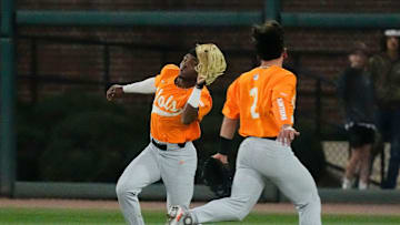 Mar 21, 2025; Tuscaloosa AL, USA; Tennessee utility player Jay Abernathy (8) rushes in and makes the catch on a fly ball in shallow left as Tennessee infielder Ariel Antigua (2) runs out during game 2 of the series with Alabama at Sewell-Thomas Stadium.