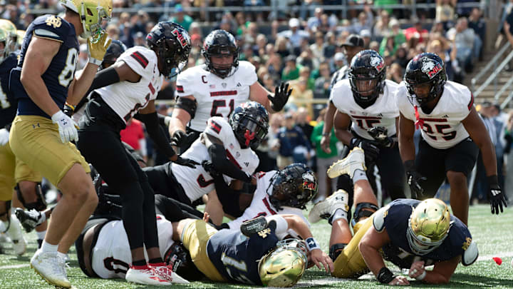 Notre Dame quarterback Riley Leonard (13) falls backwards into the end zone to score a touchdown during a NCAA college football game between Notre Dame and Northern Illinois at Notre Dame Stadium on Saturday, Sept. 7, 2024, in South Bend.