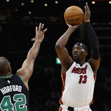 May 1, 2024; Boston, Massachusetts, USA; Miami Heat center Bam Adebayo (13) shoots against Boston Celtics center Al Horford (42) during the first quarter of game five of the first round of the 2024 NBA playoffs at TD Garden. Mandatory Credit: Winslow Townson-USA TODAY Sports