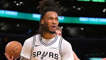 Dec 10, 2025; Los Angeles, California, USA;  San Antonio Spurs guard Stephon Castle (5) reats after a basket and a foul called on Los Angeles Lakers guard Luka Doncic (77) during the first half at Crypto.com Arena. Mandatory Credit: Jayne Kamin-Oncea-Imagn Images