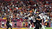 Oct 27, 2024; Landover, Maryland, USA; Washington Commanders wide receiver Noah Brown (85) catches a Hail Mary pass that was tipped with no time left to beat the Chicago Bears at Commanders Field. Mandatory Credit: Peter Casey-Imagn Images