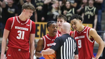 Wisconsin Badgers guard Kamari McGee (4) talks to an official after being ejected Saturday, Feb. 15, 2025, during the NCAA men’s basketball game against the Purdue Boilermakers at Mackey Arena in West Lafayette, Ind.