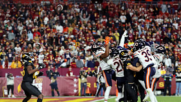 Oct 27, 2024; Landover, Maryland, USA; Washington Commanders wide receiver Noah Brown (85) catches a Hail Mary pass that was tipped with no time left to beat the Chicago Bears at Commanders Field. Mandatory Credit: Peter Casey-Imagn Images