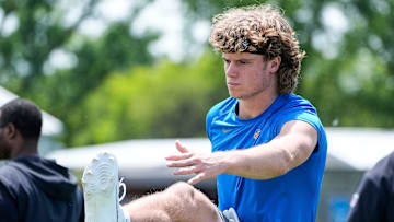Detroit Lions wide receiver Isaac TeSlaa (18) stretches after practice during OTA at Meijer Performance Center in Allen Park on Friday, May 30, 2025.