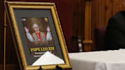 A photo of newly announced Pope Leo XIV sits next to Bishop Robert Coerver of the Catholic Diocese of Lubbock as he speaks at a news conference on May 8, 2025, in Lubbock, Texas, about American-born Cardinal Robert Prevost being chosen as the leader of the Roman Catholic Church.