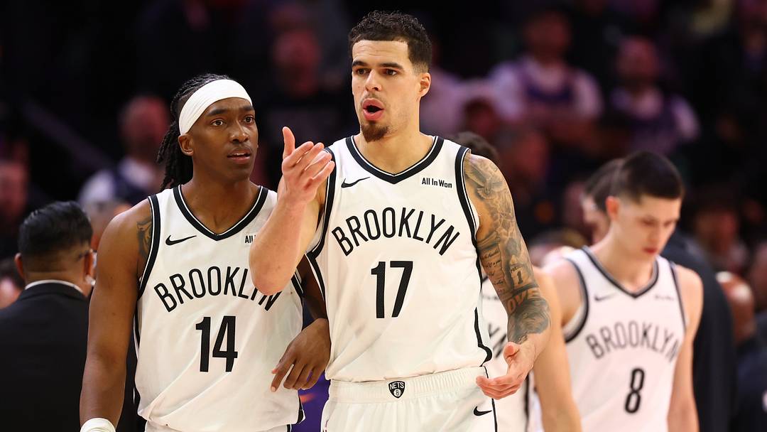 Jan 27, 2026; Phoenix, Arizona, USA; Brooklyn Nets forward Michael Porter Jr. (17) and guard Terance Mann (14) against the Phoenix Suns at Mortgage Matchup Center. Mandatory Credit: Mark J. Rebilas-Imagn Images