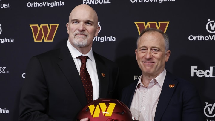 Feb 5, 2024; Ashburn, VA, USA; Washington Commanders head coach Dan Quinn (L) poses for a picture with Commanders managing partner Josh Harris (R) at Quinn's introductory press conference at Commanders Park. Mandatory Credit: Geoff Burke-USA TODAY Sports