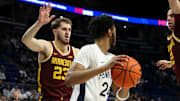 Feb 4, 2025; University Park, Pennsylvania, USA; Minnesota Golden Gophers forward Parker Fox (23) defends as Penn State Nittany Lions forward Zach Hicks (24) holds the ball during the first half at Bryce Jordan Center. Mandatory Credit: Matthew O'Haren-Imagn Images