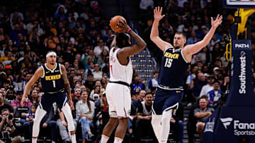 Oct 26, 2024; Denver, Colorado, USA; Los Angeles Clippers guard James Harden (1) controls the ball as Denver Nuggets center Nikola Jokic (15) guards in the fourth quarter at Ball Arena. Mandatory Credit: Isaiah J. Downing-Imagn Images