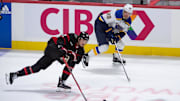Mar 21, 2024; Ottawa, Ontario, CAN; Ottawa Senators defenseman Thomas Chabot (72) moves the puck away from St. Louis Blues left wing Pavel Buchnevich (89) in the third period at the Canadian Tire Centre. Mandatory Credit: Marc DesRosiers-Imagn Images