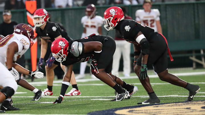 Savannah Christian's Elijah Griffin and LaDamion Guyton prepare for the snap on Friday, August 23, 2024 at Pooler Stadium.