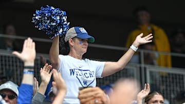 Jun 19, 2024; Omaha, NE, USA;  A fan for the Kentucky Wildcats cheers action against the Florida Gators during the fourth inning at Charles Schwab Field Omaha. Mandatory Credit: Steven Branscombe-Imagn Images