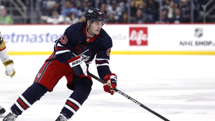 Mar 28, 2024; Winnipeg, Manitoba, CAN; Winnipeg Jets center Sean Monahan (23) skates through the neutral zone in the second period against the Vegas Golden Knights at Canada Life Centre. Mandatory Credit: James Carey Lauder-USA TODAY Sports