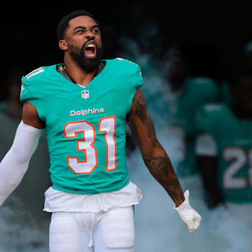 Dec 22, 2024; Miami Gardens, Florida, USA; Miami Dolphins running back Raheem Mostert (31) reacts as he enters the field before the game against the San Francisco 49ers at Hard Rock Stadium. Mandatory Credit: Sam Navarro-Imagn Images