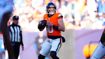 Dec 15, 2024; Denver, Colorado, USA; Denver Broncos quarterback Bo Nix (10) drops to pass in the first quarter against the Indianapolis Colts at Empower Field at Mile High.