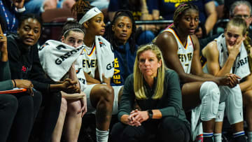 Jun 10, 2024; Uncasville, Connecticut, USA; Indiana Fever guard Caitlin Clark (22) on the bench with her teammates in the second half as they take on the Connecticut Sun at Mohegan Sun Arena. Mandatory Credit: David Butler II-USA TODAY Sports