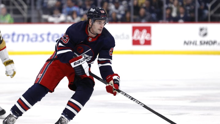 Mar 28, 2024; Winnipeg, Manitoba, CAN; Winnipeg Jets center Sean Monahan (23) skates through the neutral zone in the second period against the Vegas Golden Knights at Canada Life Centre. Mandatory Credit: James Carey Lauder-USA TODAY Sports