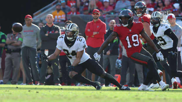 New Orleans Saints safety Johnathan Abram (24) intercepts a ball intended for Tampa Bay Buccaneers receiver David Moore (19)