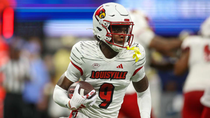 Sep 1, 2023; Atlanta, Georgia, USA; Louisville Cardinals wide receiver Ahmari Huggins-Bruce (9) runs the ball against the Georgia Tech Yellow Jackets in the second quarter at Mercedes-Benz Stadium. 