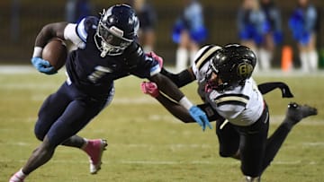 Dorman running back Nick Means (1) breaks the tackle of Gaffney Ayden Montgomery (14) Friday, Oct. 24, 2025, during the SCHSL football game at Dorman High School in Roebuck, South Carolina.
