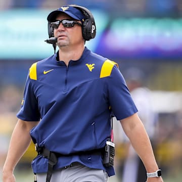 Texas football is targeting former West Virginia head coach Neal Brown for an assistant role on its staff.