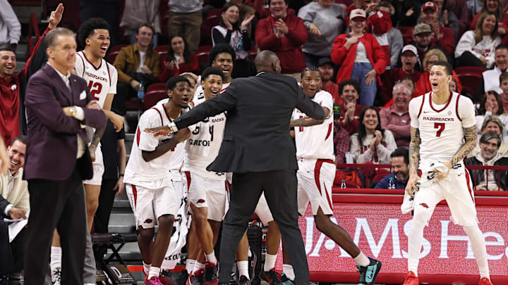 Dec 29, 2025; Fayetteville, Arkansas, USA; Arkansas Razorbacks forward Trevon Brazile (7) and teammates celebrate after a three point shot in the second half against the James Madison Dukes at Bud Walton Arena. Arkansas won 103-74. Mandatory Credit: Nelson Chenault-Imagn Images