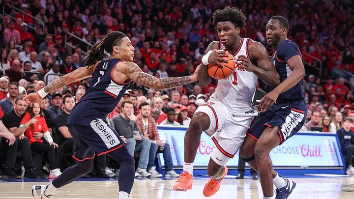 Feb 23, 2025; New York, New York, USA;  St. John's basketball guard Kadary Richmond (1) drives past Connecticut Huskies guard Solo Ball (1) in the second half at Madison Square Garden.