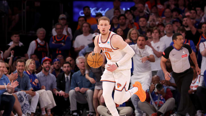 May 19, 2024; New York, New York, USA; New York Knicks guard Donte DiVincenzo (0) brings the ball up court against the Indiana Pacers during the third quarter of game seven of the second round of the 2024 NBA playoffs at Madison Square Garden. Mandatory Credit: Brad Penner-Imagn Images