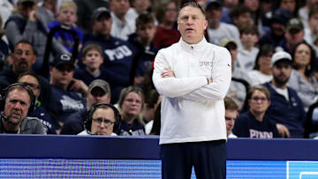 Penn State Nittany Lions head coach Mike Rhoades looks on from the bench during the first half against the Penn Quakers at Bryce Jordan Center. 