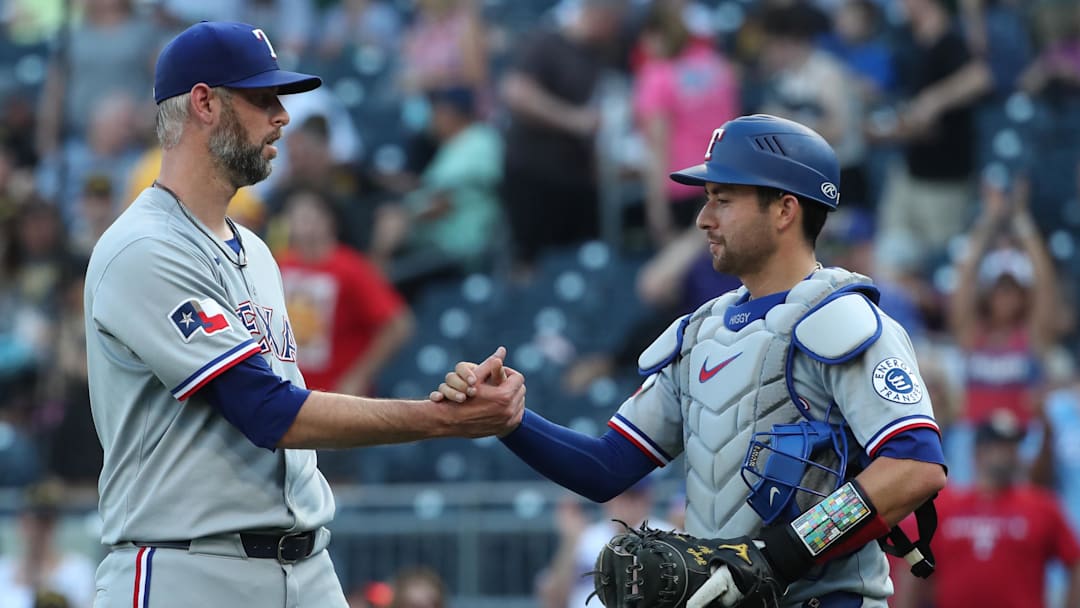 Jun 21, 2025; Pittsburgh, Pennsylvania, USA;  Texas Rangers pitcher Chris Martin (55) and catcher Kyle Higashioka (11) celebrate after defeating the Pittsburgh Pirates at PNC Park. Mandatory Credit: Charles LeClaire-Imagn Images