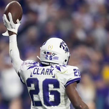 Dec 31, 2022; Glendale, Arizona, USA; TCU Horned Frogs safety Bud Clark (26) celebrates a play against the Michigan Wolverines during the 2022 Fiesta Bowl at State Farm Stadium. Mandatory Credit: Mark J. Rebilas-Imagn Images