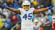 Dec 3, 2023; Foxborough, Massachusetts, USA; Los Angeles Chargers linebacker Tuli Tuipulotu (45) reacts after stopping the first down against the New England Patriots in the second quarter at Gillette Stadium.