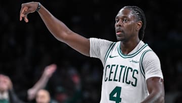  Boston Celtics guard Jrue Holiday (4) reacts after making a three-point shot ]against the Brooklyn Nets during the second half at Barclays Center.
