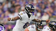 Nov 9, 2025; Minneapolis, Minnesota, USA; Baltimore Ravens quarterback Lamar Jackson (8) under center against the Minnesota Vikings in the fourth quarter at U.S. Bank Stadium. Mandatory Credit: Brad Rempel-Imagn Images