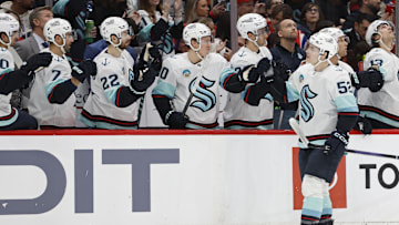 Jan 11, 2024; Washington, District of Columbia, USA; Seattle Kraken left wing Tye Kartye (52) celebrates with teammates after scoring a goal against the Washington Capitals in the first period at Capital One Arena. Mandatory Credit: Geoff Burke-Imagn Images