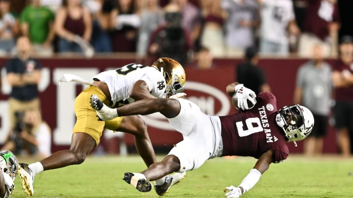 Aug 31, 2024; College Station, Texas, USA; Notre Dame Fighting Irish cornerback Christian Gray (29) tackles Texas A&M Aggies defensive back Trey Jones III (9) in the fourth quarter at Kyle Field. Mandatory Credit: Maria Lysaker-USA TODAY Sports