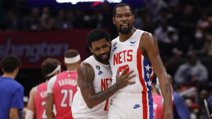 Dec 12, 2022; Washington, District of Columbia, USA; Brooklyn Nets guard Kyrie Irving (11) celebrates with Nets forward Kevin Durant (7) against the Washington Wizards in the fourth quarter at Capital One Arena. Mandatory Credit: Geoff Burke-USA TODAY Sports