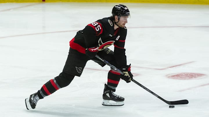 Apr 5, 2025; Ottawa, Ontario, CAN; Ottawa Senators defenseman Jake Sanderson (85) skates with the puck in the third period against the Florida Panthers at the Canadian Tire Centre. Mandatory Credit: Marc DesRosiers-Imagn Images