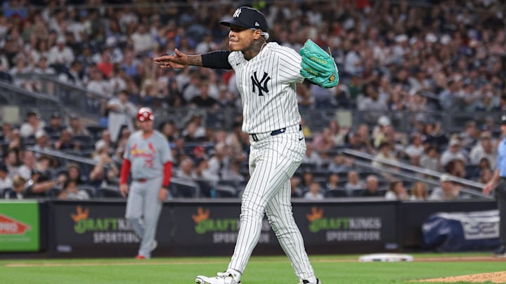 Aug 30, 2024; Bronx, New York, USA; New York Yankees starting pitcher Marcus Stroman (0) reacts after a double play ends the the top of the sixth inning against the St. Louis Cardinals at Yankee Stadium. Mandatory Credit: Vincent Carchietta-Imagn Images