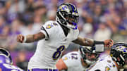 Nov 9, 2025; Minneapolis, Minnesota, USA; Baltimore Ravens quarterback Lamar Jackson (8) under center against the Minnesota Vikings in the fourth quarter at U.S. Bank Stadium. Mandatory Credit: Brad Rempel-Imagn Images