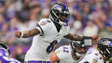 Nov 9, 2025; Minneapolis, Minnesota, USA; Baltimore Ravens quarterback Lamar Jackson (8) under center against the Minnesota Vikings in the fourth quarter at U.S. Bank Stadium. Mandatory Credit: Brad Rempel-Imagn Images