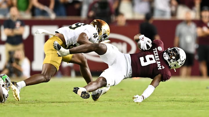 Aug 31, 2024; College Station, Texas, USA; Notre Dame Fighting Irish cornerback Christian Gray (29) tackles Texas A&M Aggies defensive back Trey Jones III (9) in the fourth quarter at Kyle Field. 