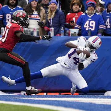 Nov 16, 2025; Orchard Park, New York, USA;  Buffalo Bills wide receiver Tyrell Shavers (14) makes a touchdown catch against Tampa Bay Buccaneers cornerback Benjamin Morrison (21)