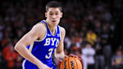 Feb 8, 2025; Cincinnati, Ohio, USA; Brigham Young Cougars guard Egor Demin (3) dribbles against the Cincinnati Bearcats in the second half at Fifth Third Arena. Mandatory Credit: Katie Stratman-Imagn Images